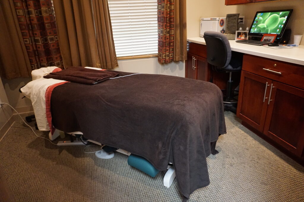 Bed in the massage therapist room at the Bakeris Family Chiropractic in Coralville, Iowa